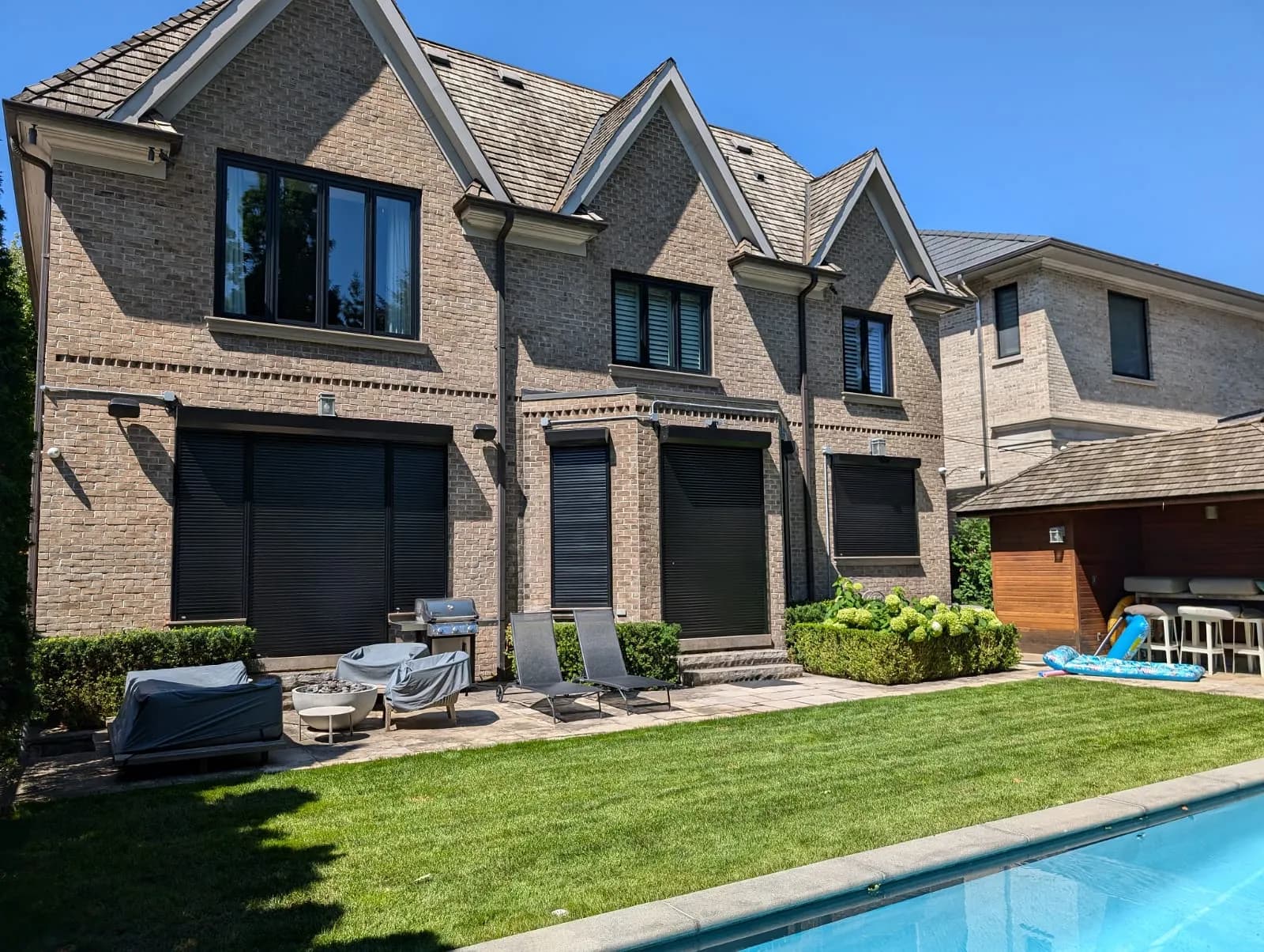 Motorized aluminum roll shutter installed on a residential window in Ontario